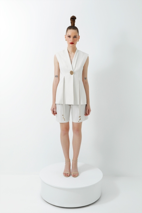 Gizia Double Ecru Suit with Tasselled Accessory Detail and Pleated Shorts. 1 Gizia Double Ecru Suit with Tasselled Accessory Detail and Pleated Shorts. 1
